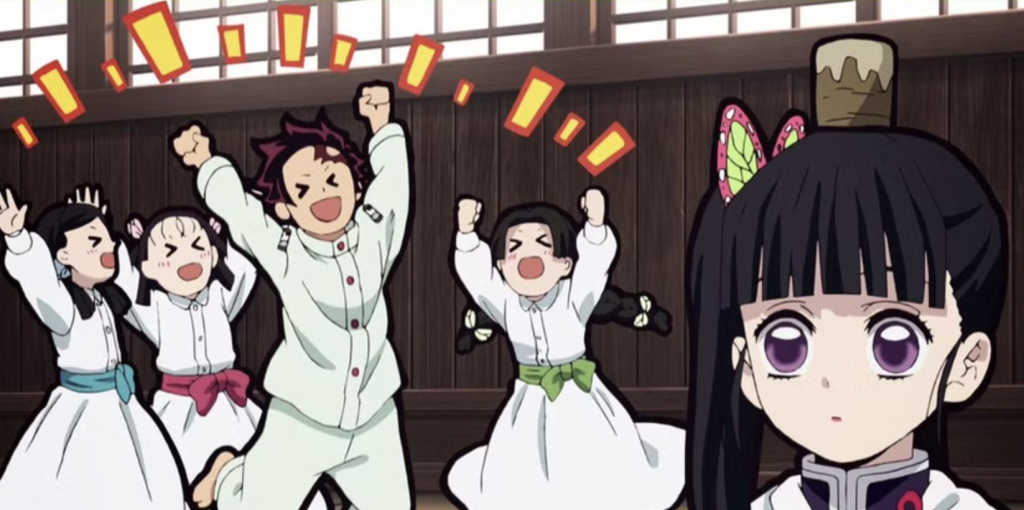 a still of tanjiro and the three young girls cheering after he successfully place the cup on kanao's head in demon slayer