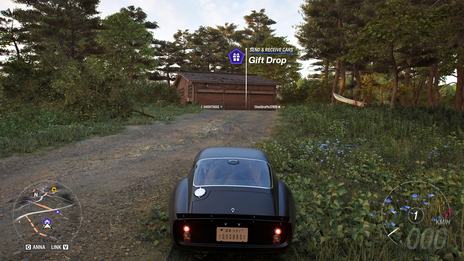 Forza Horizon 6 gameplay screenshot showing the "Gift Drop" prompt appear near a Barn Find location.