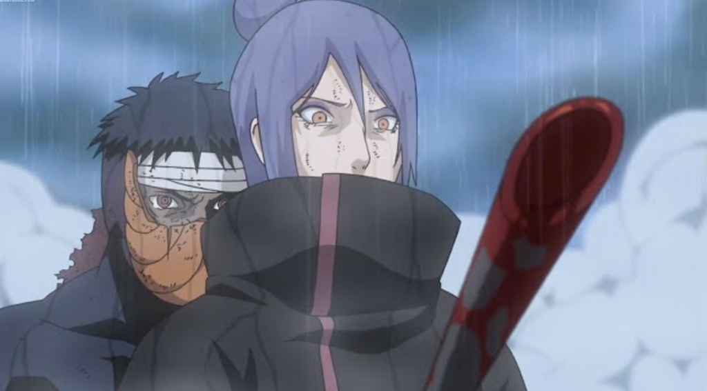 This scene features Konan confronting Obito Uchiha, who is wearing his orange mask, in Naruto Shippuden