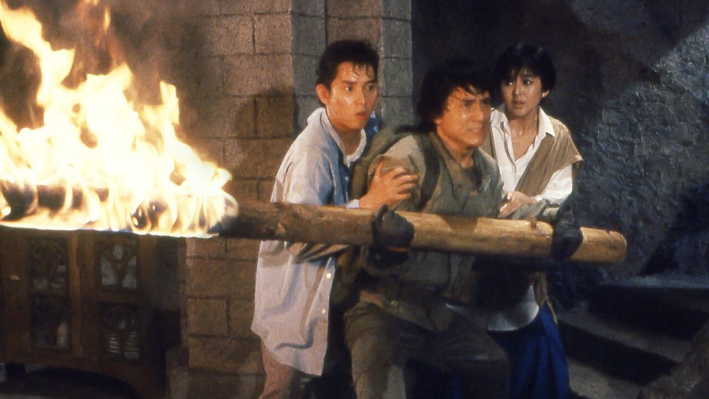 Jackie Chan with a pole of fire