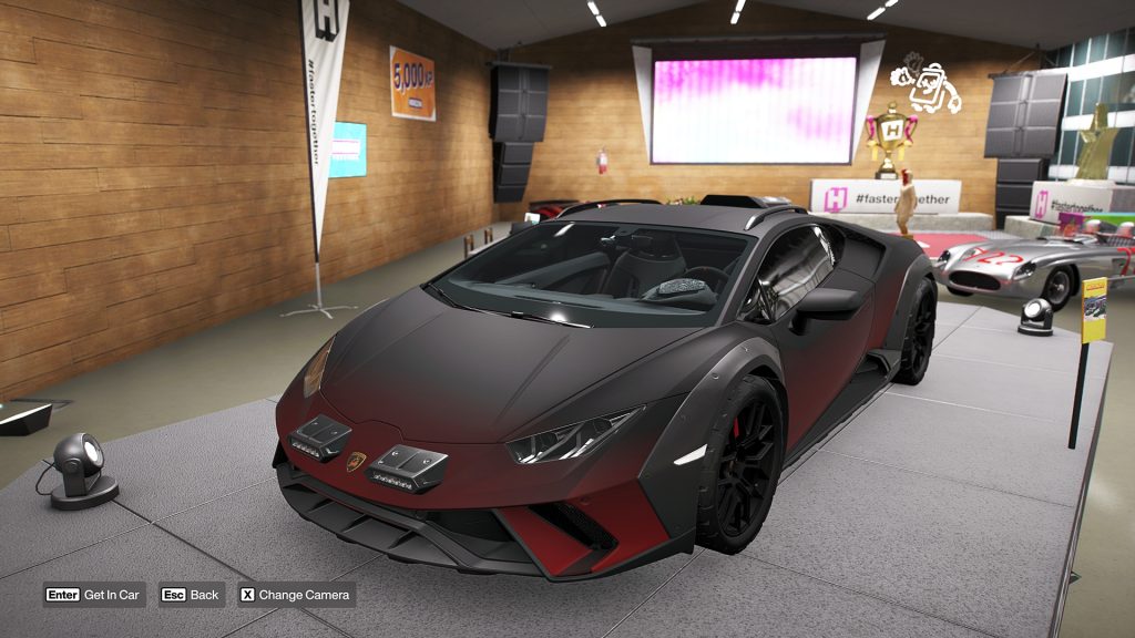 Forza Horizon 6 in-game image of the Lamborghini Huracán Sterrato showcased on a podium.