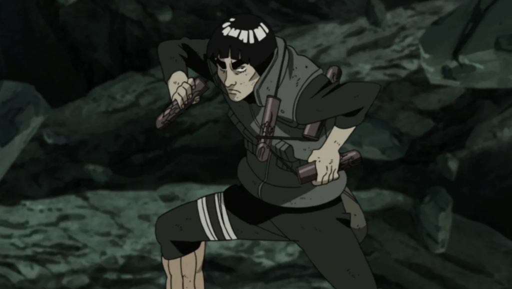 The character shown is Might Guy from the anime series Naruto Shippuden and he is holding his signature weapon, a pair of nunchaku known as Twin Attacking Fangs