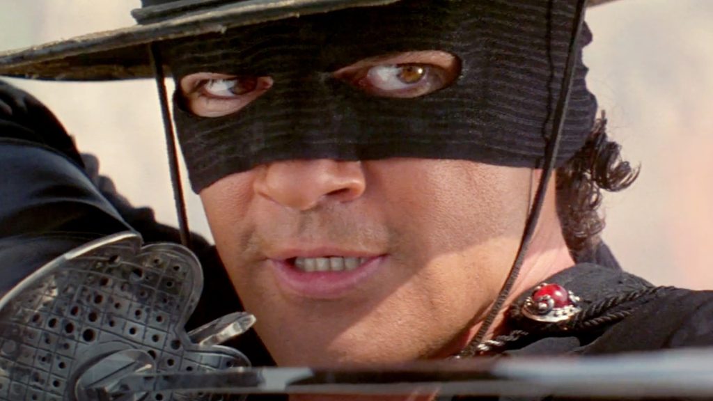 Zorro points a sword