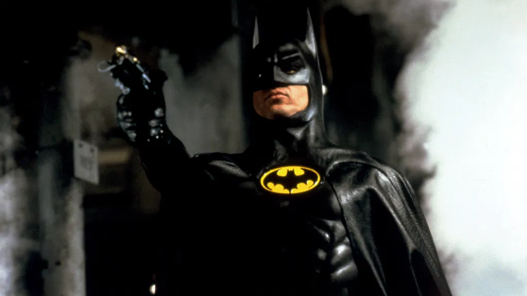 Batman points his gun