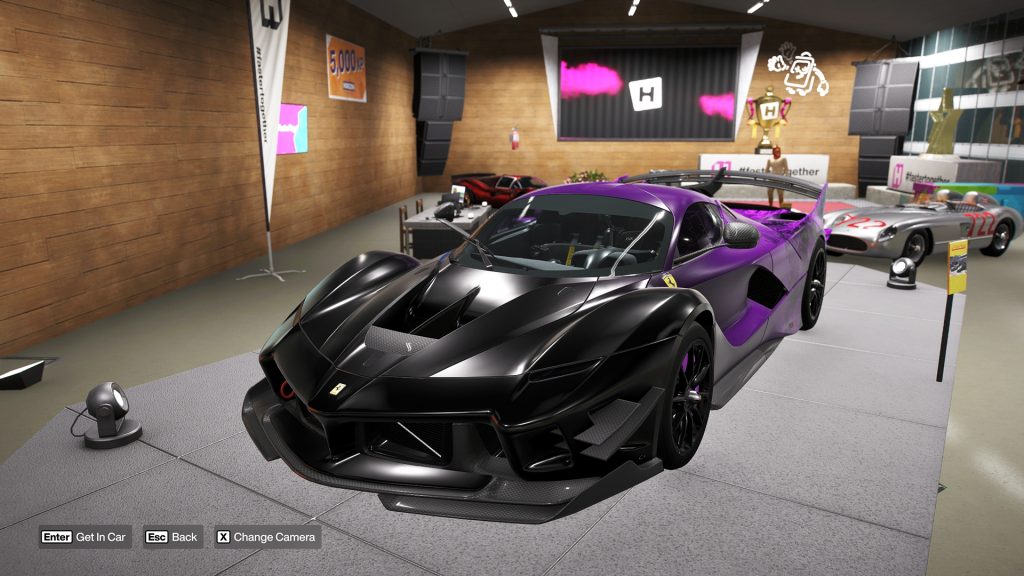 The Ferrari FXX-K Evo 'Welcome Pack' DLC version showcased on a podium in the Forza Horizon 6 garage.