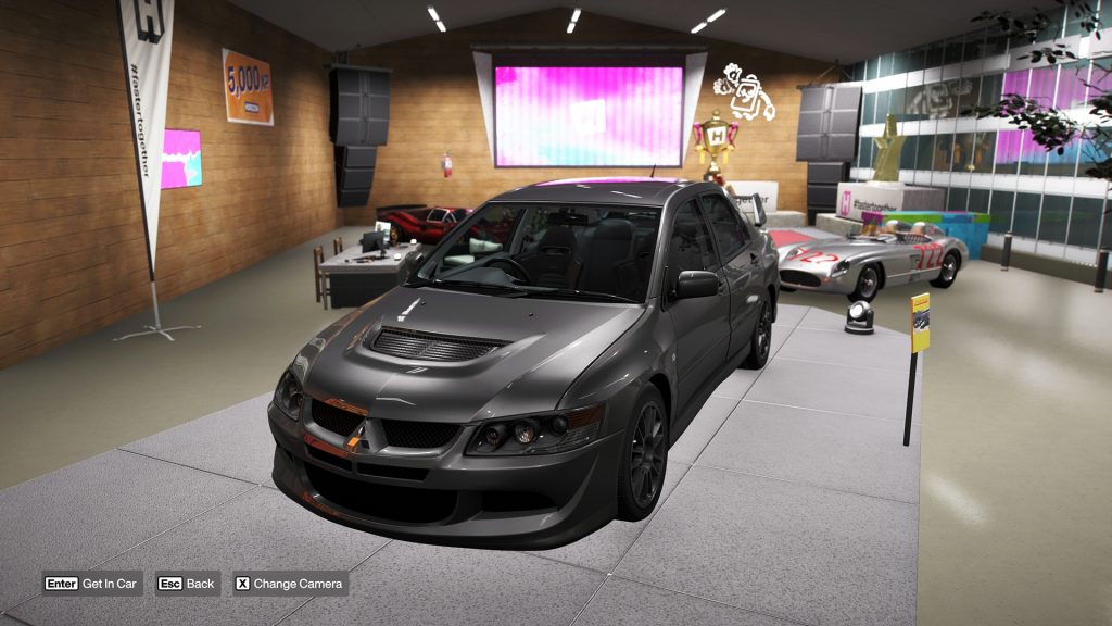 Forza Horizon 6 image featuring the Mitsubishi Lancer Evolution VIII MR Welcome Pack displayed on a podium.