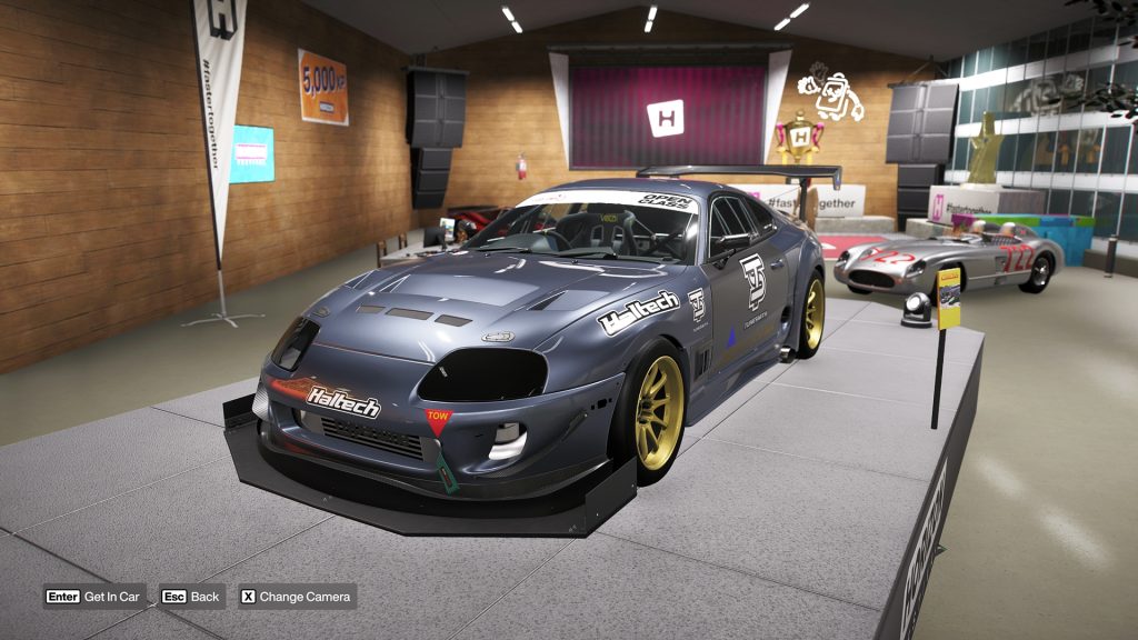 Forza Horizon 6 screenshot presenting the Toyota J&J Motorsport Supra WTAC inside the garage.