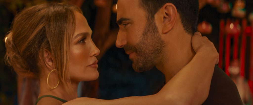 Office Romance. (L-R) Jennifer Lopez as Jackie Cruz and Brett Goldstein as Daniel Blanchflower in Office Romance. Cr. Netflix © 2026.