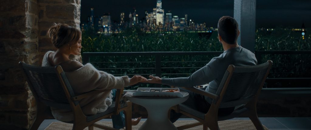 Office Romance. (L-R) Jennifer Lopez as Jackie Cruz and Brett Goldstein as Daniel Blanchflower in Office Romance. Cr. Netflix © 2026.