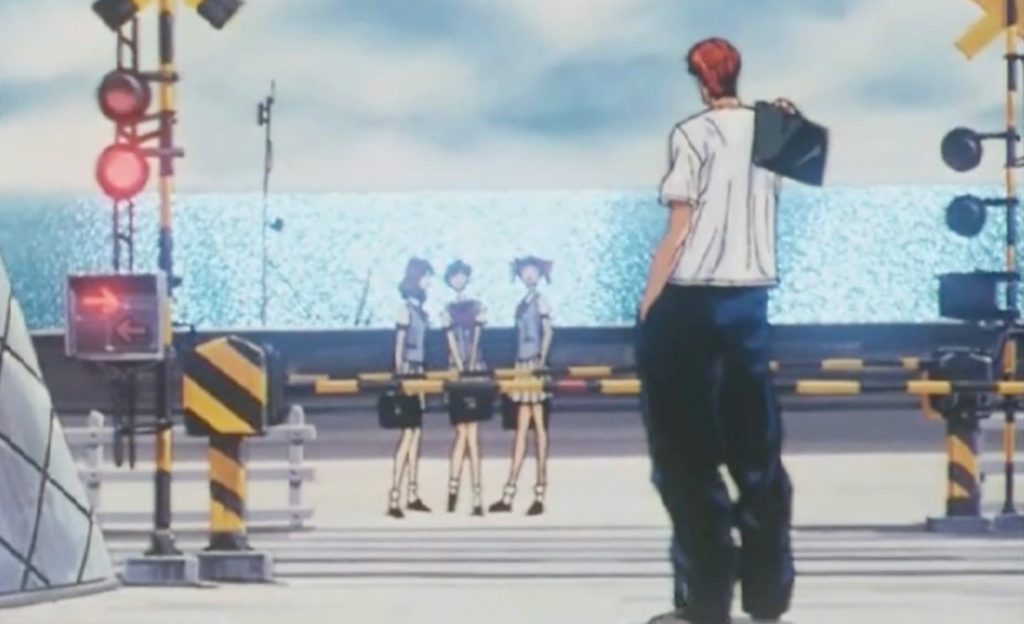 Hanamichi Sakuragi standing near the Kamakurakokomae railway crossing featured in Slam Dunk.