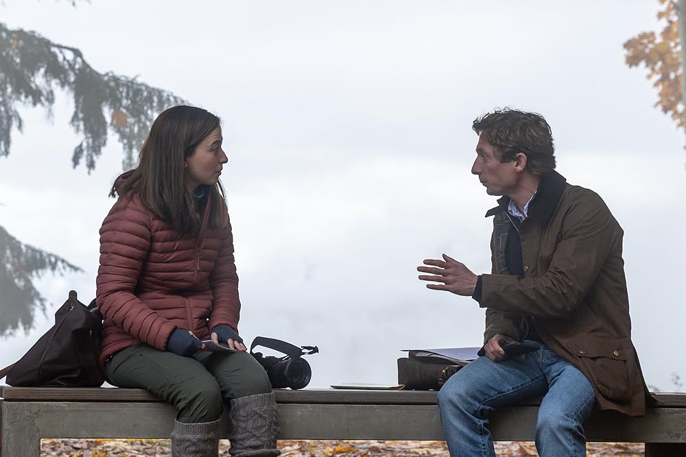 Mikey Madison and Jeremy Allen White as Frances Haugen and Jeff Horwitz in The Social Reckoning, sitting on a bench in conversation outdoors