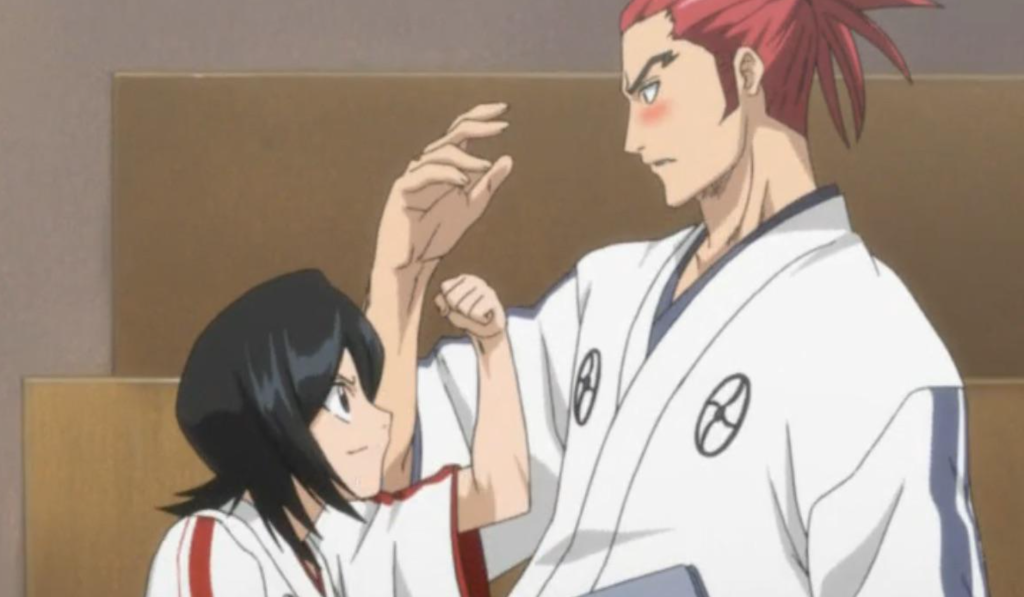 This scene shows Rukia Kuchiki and Renji Abarai from the anime series Bleach and the image depicts a flashback to their time together in the Soul Reaper Academy