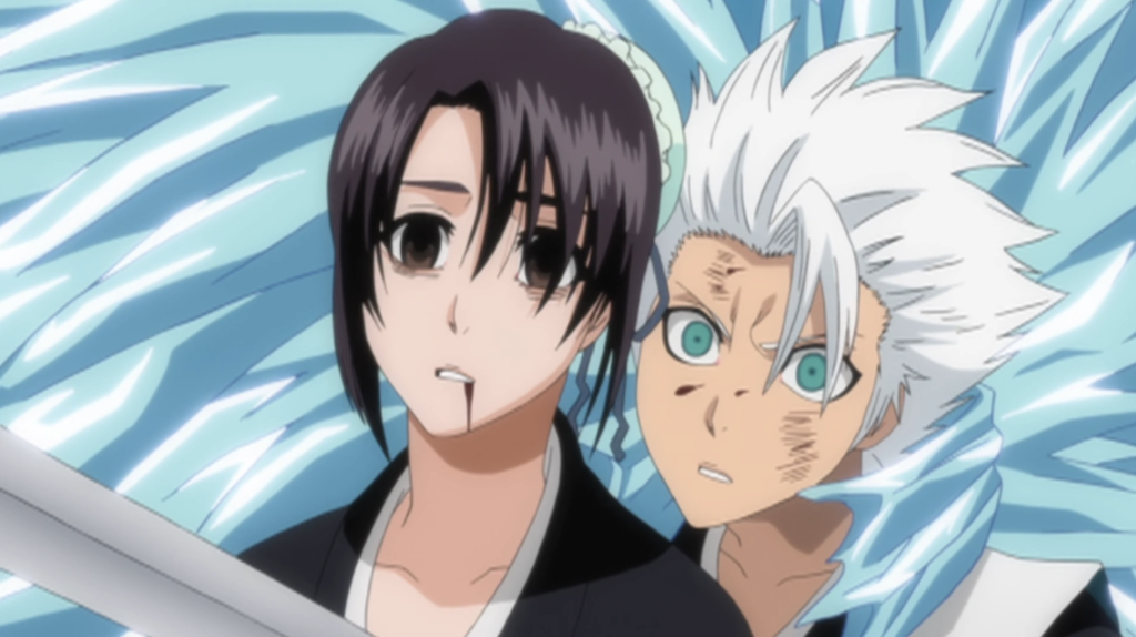 This scene is from the anime series Bleach, specifically depicting a tragic moment where Captain Tōshirō Hitsugaya stabs Momo Hinamori, who has been disguised as Sosuke Aizen using Kyoka Suigetsu