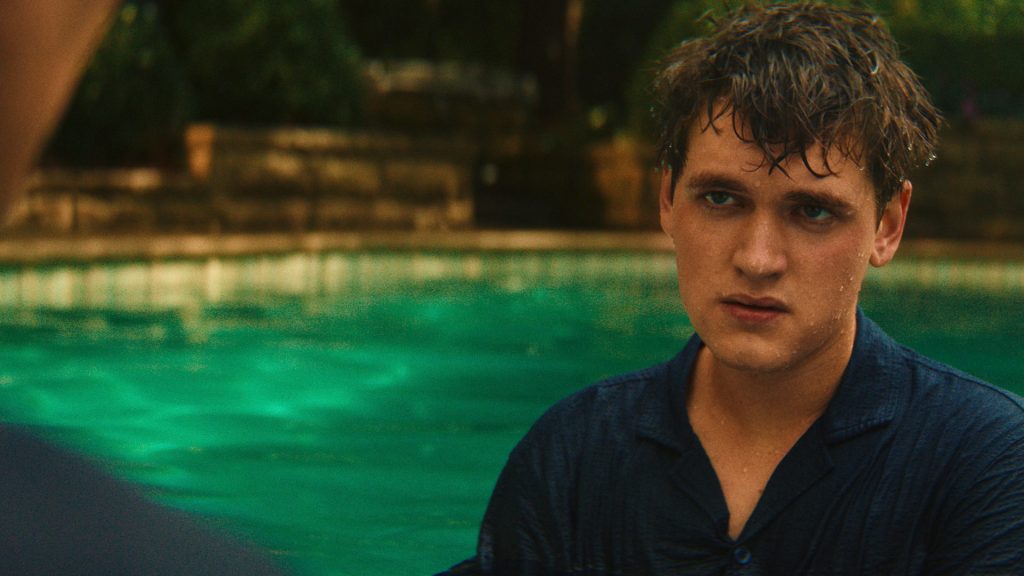 Zack Bowden, drenched and visibly distressed, in a swimming pool while listening to a serious conversation in Cape Fear Episode 4.
