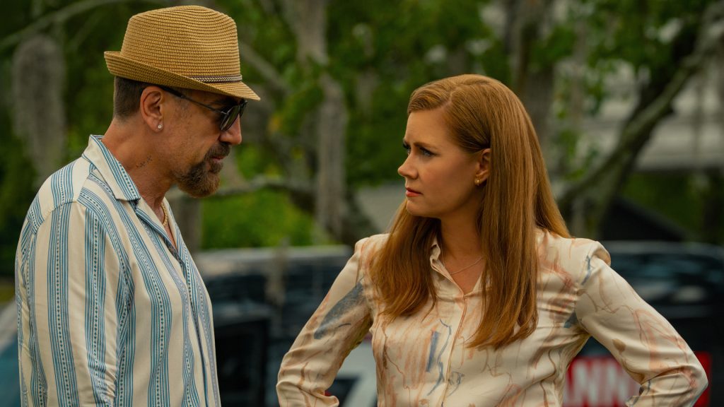 Max Cady and Anna Bowden stand face-to-face outdoors during a tense conversation, with Anna looking wary as Max speaks to her in Cape Fear Episode 4.