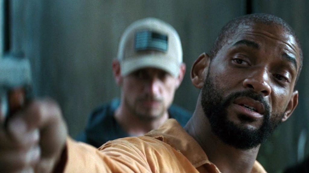 Will Smith's Deadshot points a gun
