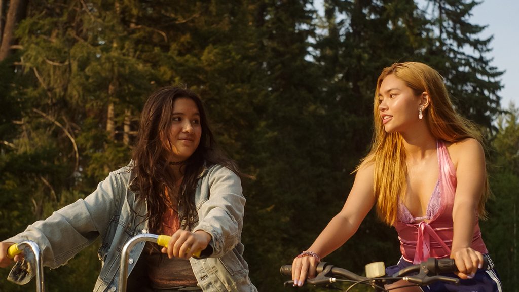 (L-R) Coley (Maya de Costa) and Sonya (Myra Molloy) riding their bikes in Girls Like Girls