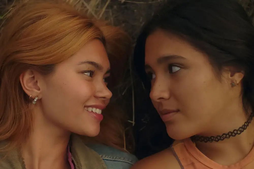 (L-R) Sonya (Myra Molloy) and Coley (Maya da Costa) romantically gazing into each other's eyes in Girls Like Girls