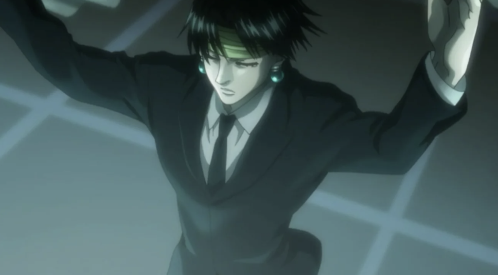 This image features Chrollo Lucilfer from Hunter x Hunter, shown wearing a sharp black suit and his signature green headband