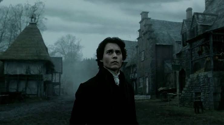 Ichabod Crane stands in the middle of the village