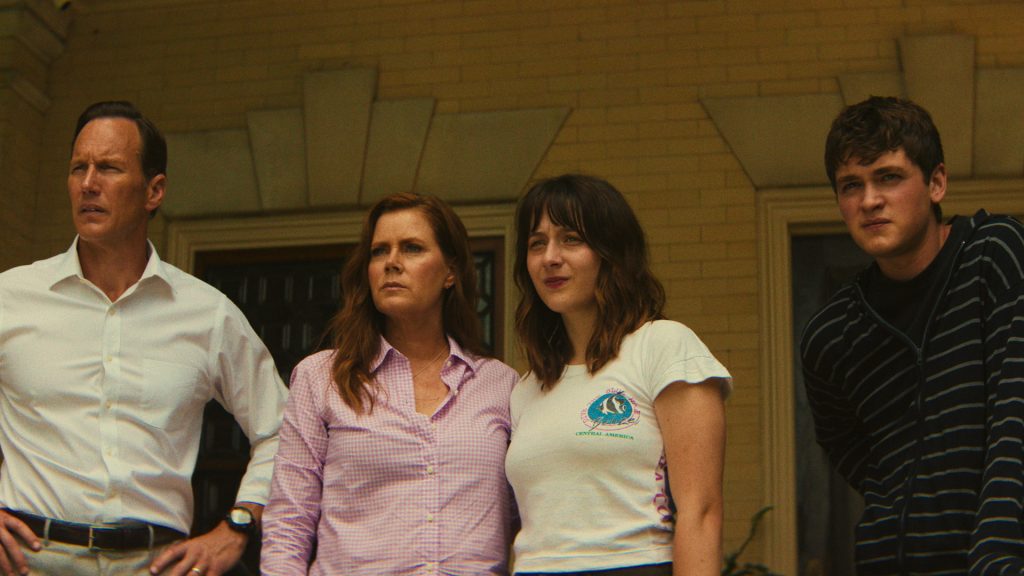 Tom, Anna, Sam, and Zack Bowden stand outside their home in stunned silence, watching events unfold as Max Cady's campaign against the family pushes them closer to total collapse.