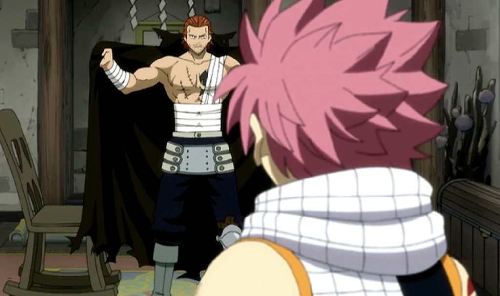 This scene features Gildarts Clive showing Natsu Dragneel the severe injuries he sustained from a Black Dragon. Gildarts explains that the dragon attacked him so quickly he lost his left arm, left leg, and an unspecified organ before he could react.