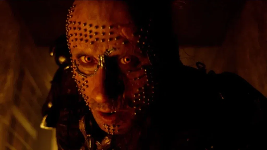 Close-up of Krem of the Yellow Hills wearing a distinctive studded facial armor