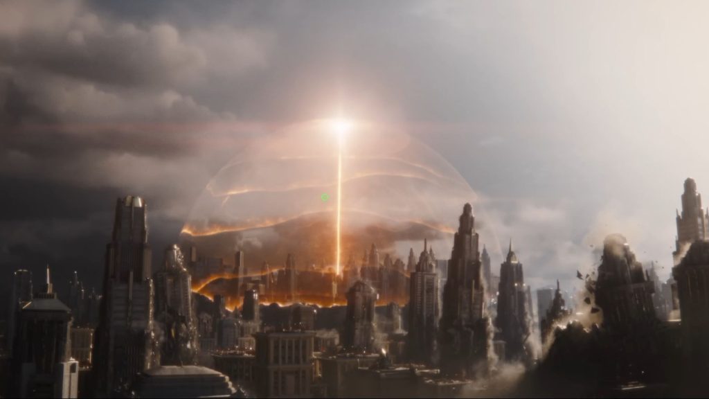 A sprawling futuristic city is engulfed in destruction as a glowing orange energy dome rises from its center, with a vertical beam of light piercing the storm-filled sky while buildings crumble around it.