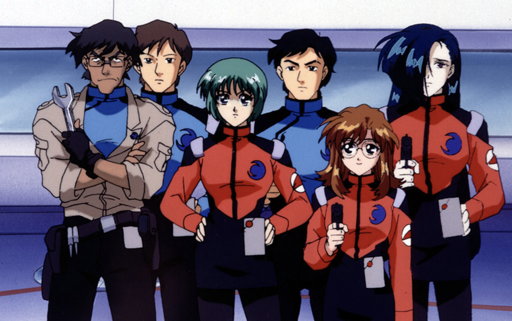 This image features the crew of the battleship Nadesico from the anime series Martian Successor Nadesico. The characters shown are wearing the standard Nergal Heavy Industries uniforms, with blue and red color schemes.