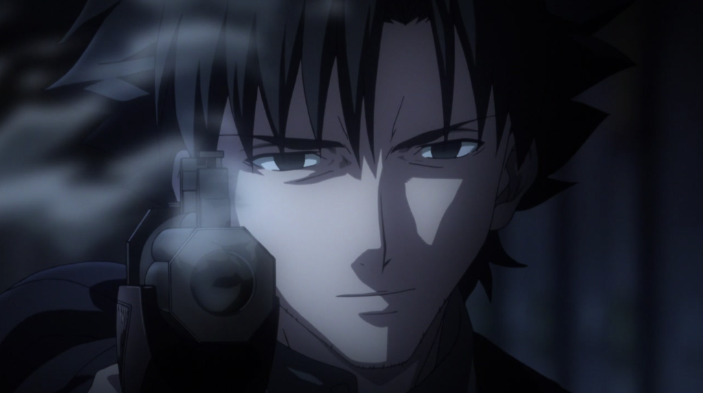 Hình ảnh này thể hiện Kiritsugu Emiya đang cầm một khẩu súng trong loạt phim hoạt hình Fate/Zero.