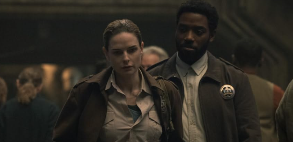 Rebecca Ferguson and Chinaza Uche in Silo (2023)