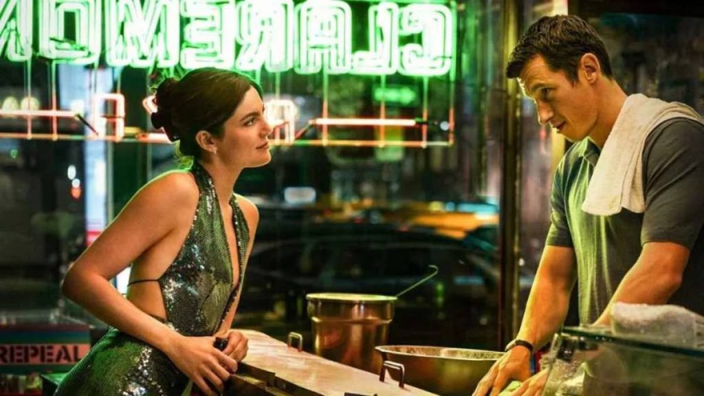 Callum Turner and Monica Barbaro in a scene from the 2026 romantic comedy One Night Only.