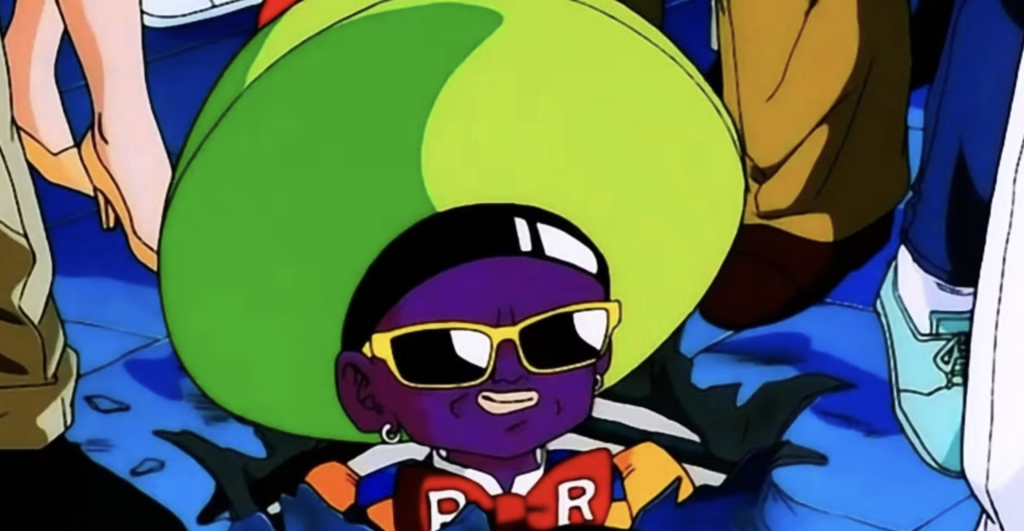 This character is Android 15, a villain from the Dragon Ball Z movie Super Android 13!. He was created by Dr. Gero’s supercomputer after Gero's death to destroy Goku. He is known for his unique appearance, which includes a large lime-green hat and sunglasses.