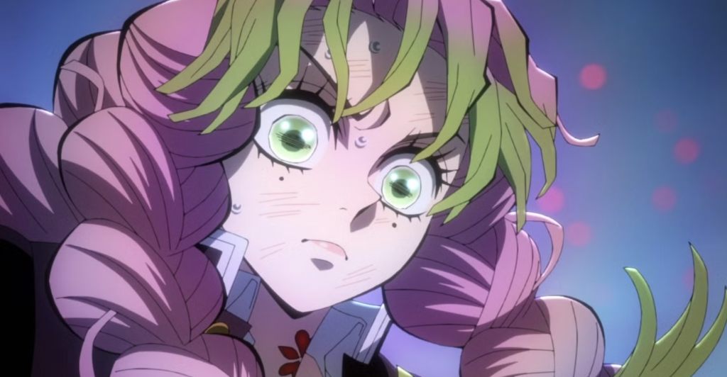  Kimetsu no Yaiba. Mitsuri is shown with her green and pink hair and her demon slayer mark active on her neck.