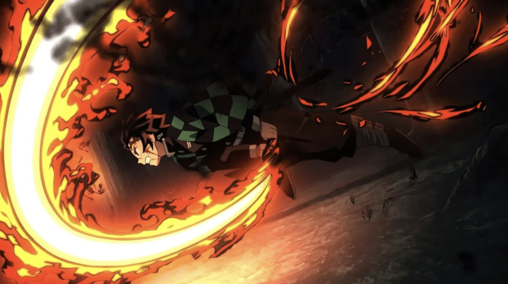  Kimetsu no Yaiba. In this scene, Tanjiro is shown performing the Hinokami Kagura (Sun Breathing) technique, which is characterized by intense fiery visual effects.