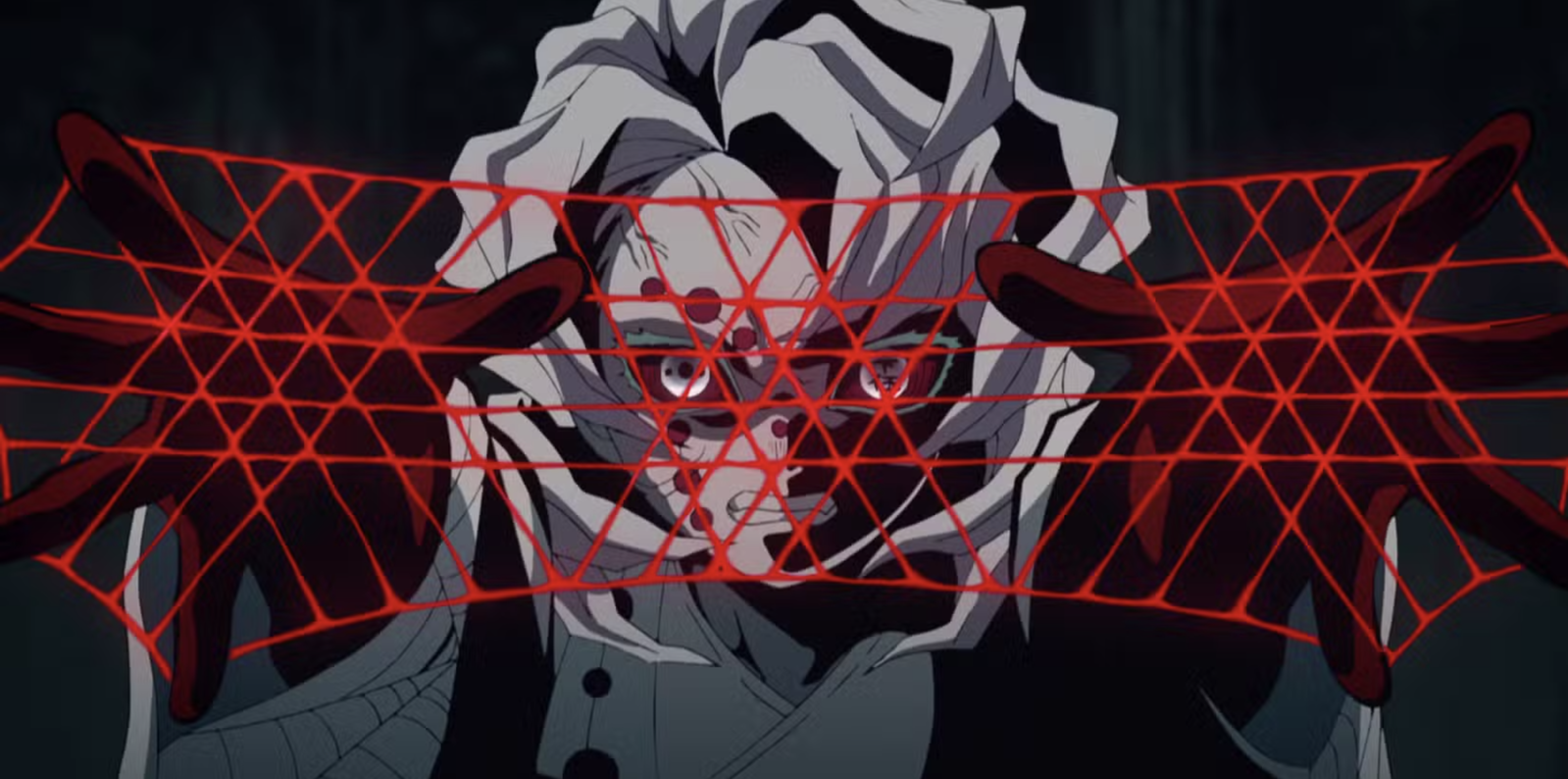 This image features the character Rui from the anime series Demon Slayer: Kimetsu no Yaiba. Rui holds the rank of Lower Moon Five within the Twelve Kizuki. He is utilizing his Blood Demon Art to create sharp, red threads to attack.