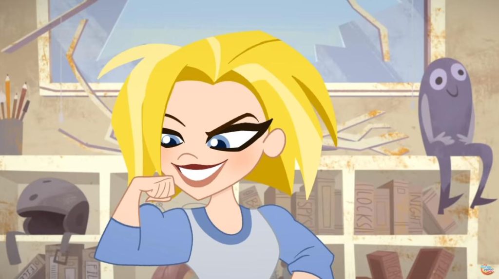 Kara Zor-El smirks and flexes her arm inside her bedroom while a small gray alien companion watches from a shelf in DC Super Hero Girls.