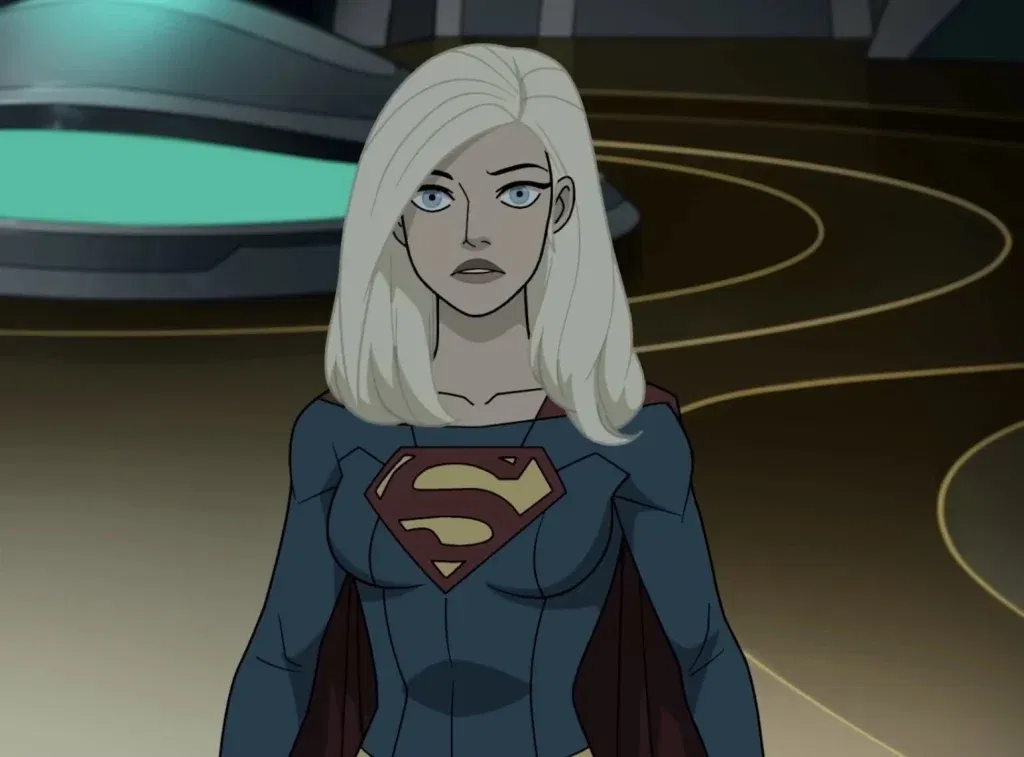 Supergirl stands with a serious expression in her blue-and-red costume inside a futuristic headquarters in the DC Animated Tomorrowverse.