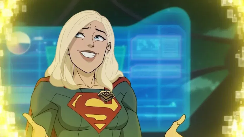 Supergirl smiles and gestures with both hands while standing inside the Legion headquarters, with glowing holographic displays behind her in Legion of Super-Heroes.