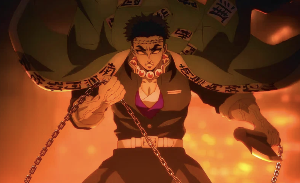  Kimetsu no Yaiba. He is depicted in a high-intensity scene wielding his unique weapon, a heavy, spiked steel ball connected by a chain to a hand axe.