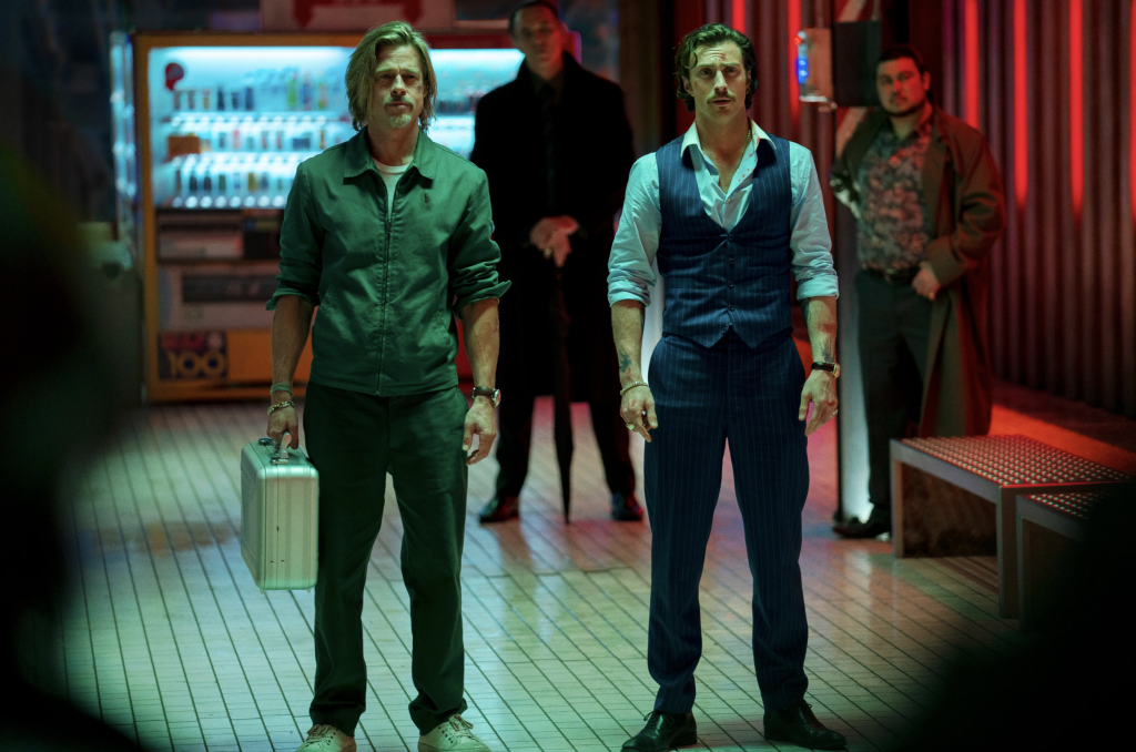 The image shows Brad Pitt and Aaron-Taylor Johnson from the Bullet Train Hollywood live-action movie.