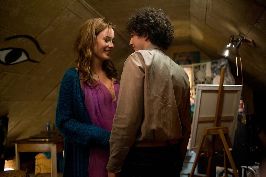 A couple share a moment in an attic art studio in a scene from Not Fade Away (2012)