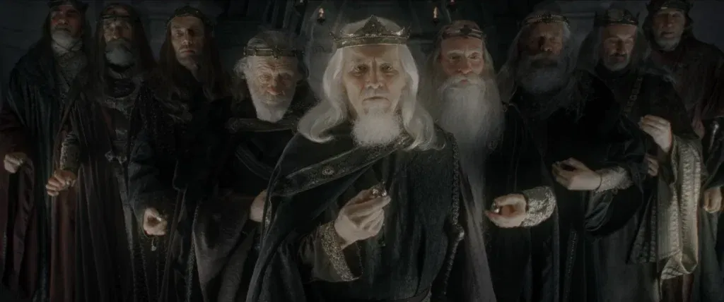 The Nine Kings of Men stand together in regal robes and crowns, each holding one of the Nine Rings of Power before their eventual transformation into the Nazgûl in The Lord of the Rings trilogy