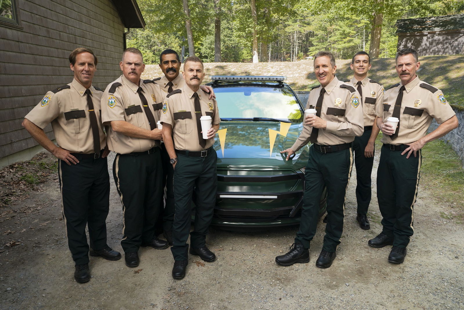 Nat Faxon, Kevin Heffernan, Jay Chandrasekhar, Steve Lemme, Paul Soter, Andrew Dismukes, and Erik Stolhanske on the set of SUPER TROOPERS 3. Photo by Patrick Harbron, Courtesy of Searchlight Pictures. © 2025 Searchlight Pictures. All Rights Reserved.