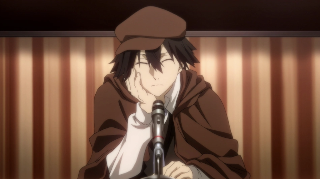 Ranpo Edogawa from the anime Bungo Stray Dogs is shown here wearing his signature brown cape and newsboy cap.