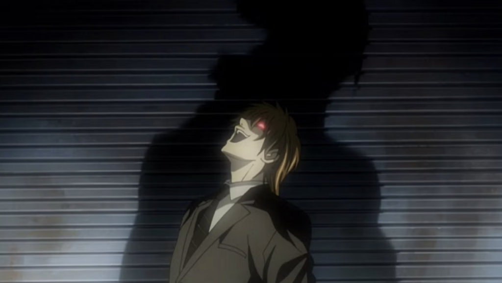 20 Years Later, The Darkest Shonen Anime of All Time Is Free to Watch on YouTube 49 This image features Light Yagami from the anime series Death Note. The scene depicts a climactic moment where Light, often known as Kira, laughs hysterically.