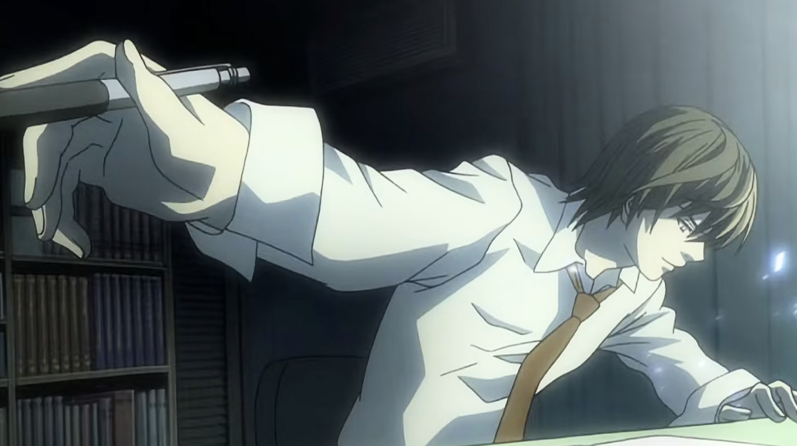 Light Yagami from Death Note is shown intensely writing in the supernatural notebook.