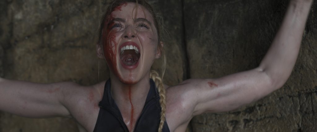 The Devil's Mouth - A young woman screams while covered in blood. 