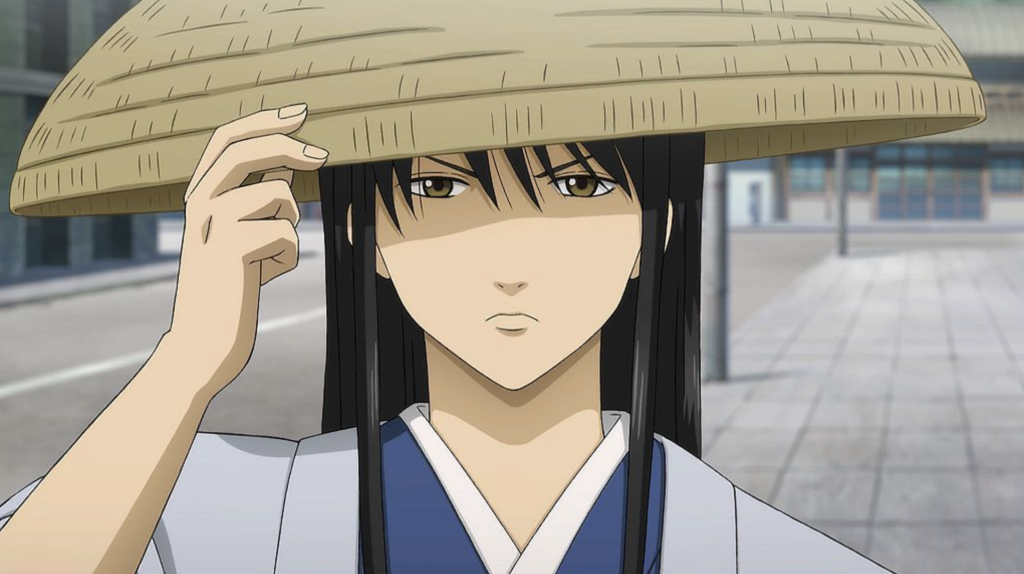 Katsura Kotarou from Gintama is depicted in this image. He is the leader of the moderate Joui faction and is a fugitive wanted by authorities.