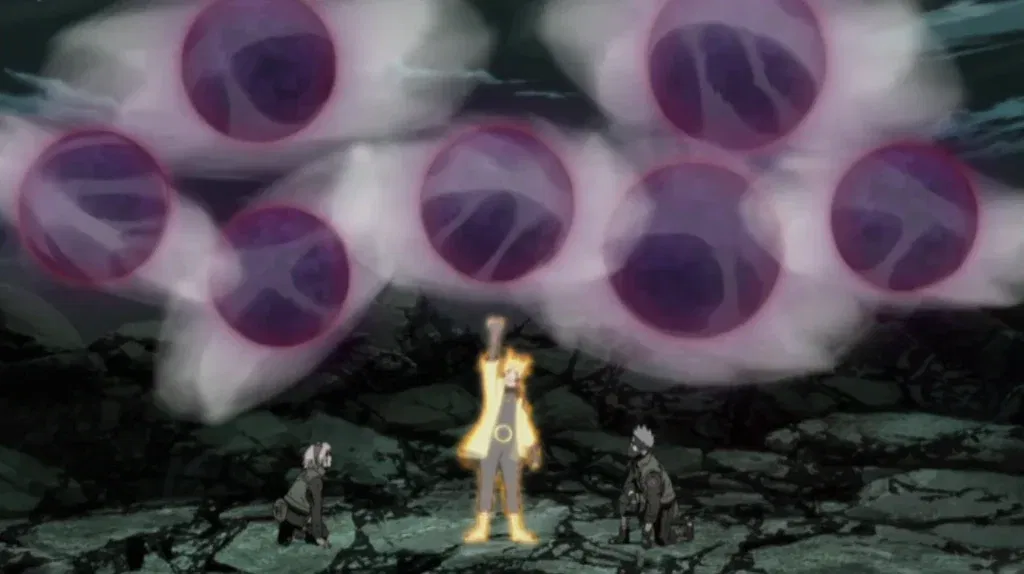 Naruto được Sakura Haruno và Kakashi Hatake đỡ, họ đang đứng dưới đất phía sau cậu.